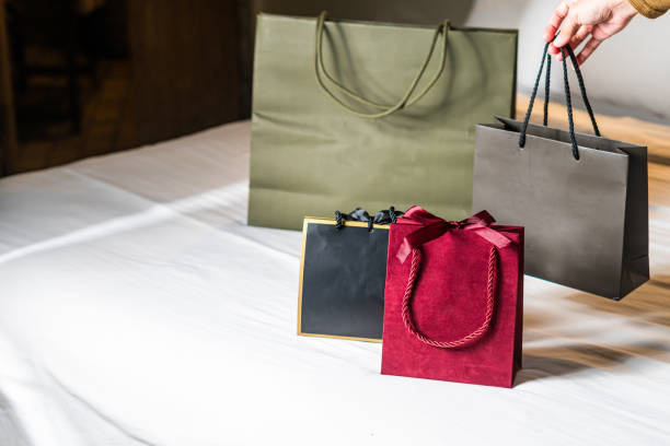Colorful Shopping Bags on a Bed