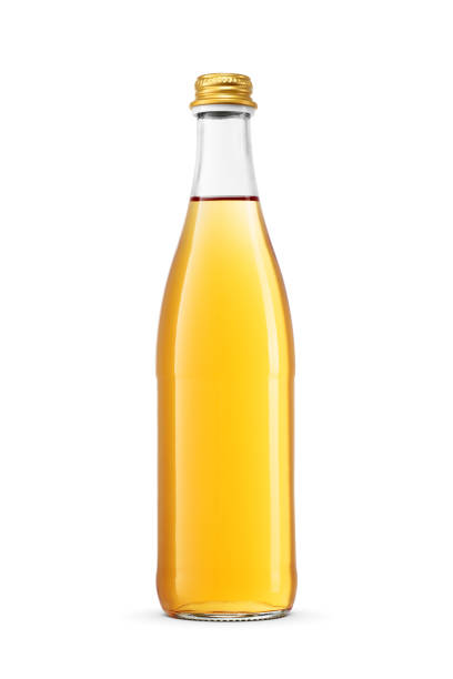 Glass bottle with sparkling orange soft drink isolated on white background.