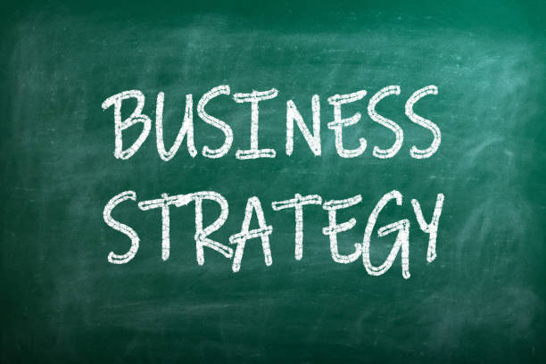 Business strategies and goals or New Year and Merry Christmas written on a school chalkboard or blackboard.