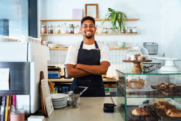 istock Barista working in a bar cafeteria 2180545808
