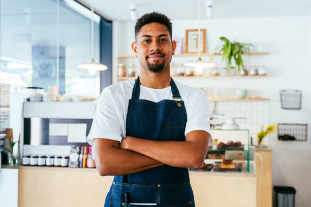 istock Barista working in a bar cafeteria 2180545856