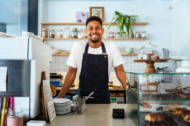 istock Barista working in a bar cafeteria 2180546390