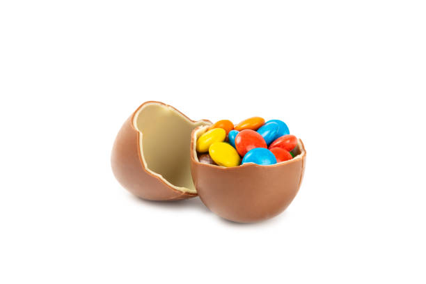 Easter chocolate bunny, chick and chocolate eggs isolated on white background. Chocolate eggs and other sweets. Easter celebration concept. Easter sweets on the table. Place for text. copy space.