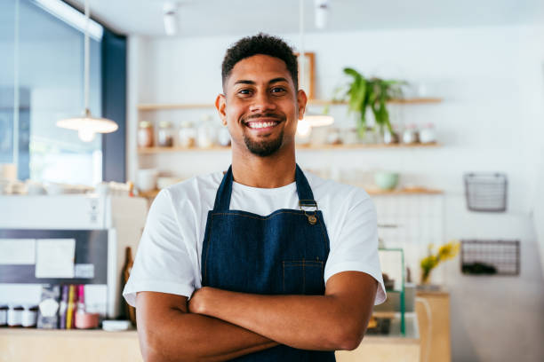 istock Barista working in a bar cafeteria 2180547463
