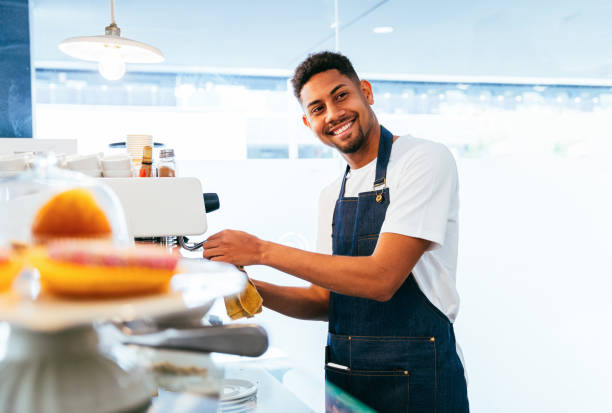 istock Barista working in a bar cafeteria 2180547527
