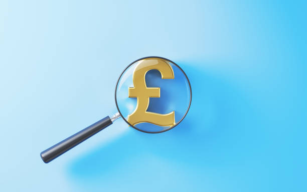 istock Magnifying Glass over Pound Symbol on Blue Background 2180549783