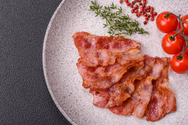 istock Delicious crispy bacon grilled with salt and spices 2180556755