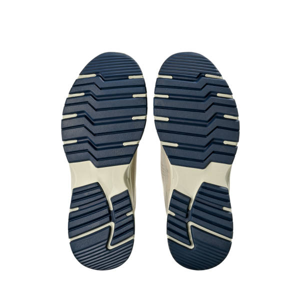 istock Bottom of Sneakers 2180557330