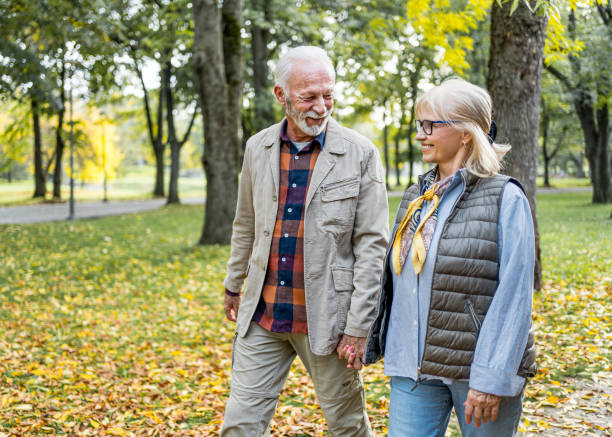 istock Senior couple going for a relaxing walk in the park 2180558331