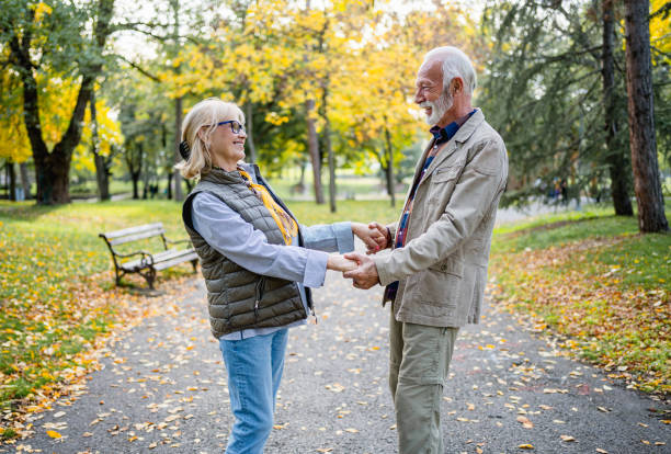istock Senior couple spending a autumn day in the park 2180558363