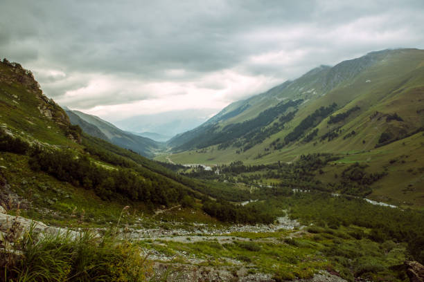 beautiful green mountain valley under blue cloudy sky