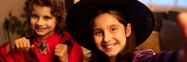 istock Girl taking selfie with demon boy 2180561206