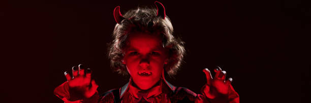istock Little vampire with horns and fangs 2180561249