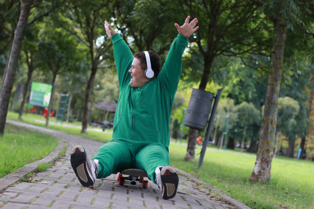 Senior man active lifestyle playing extreme sport skateboard on the street.