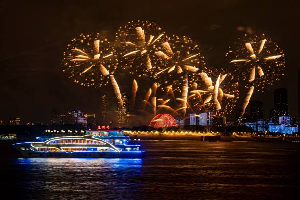 istock Illuminated boat and fireworks over cityscape 2180561795