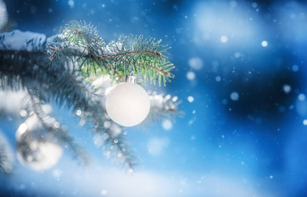 istock Decorated Christmas tree on winter abstract landscape 2180562035