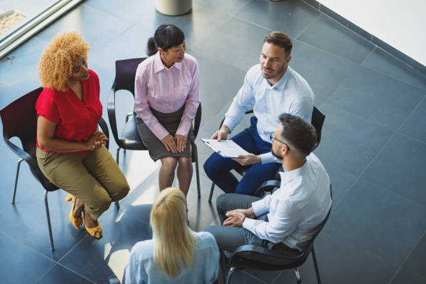 istock Therapist’s guidance in emotional support group session 2180562257