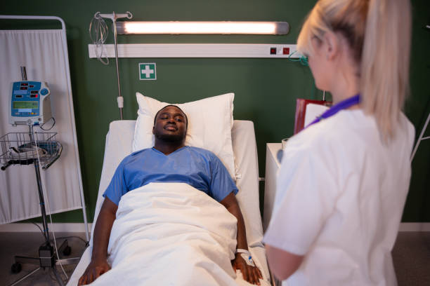 istock Doctor with a tablet engages in a friendly conversation, making medical discussions with African patient 2180562516