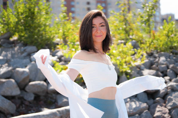 Young brunette woman enjoying morning in the city