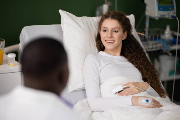 istock Both engaged, African doctor and patient review the care plan displayed on the tablet 2180567064