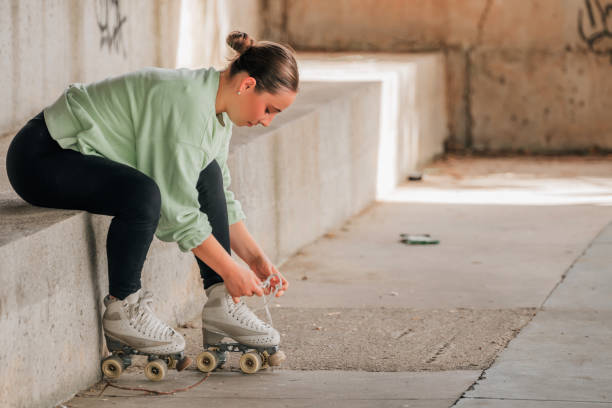 istock skater putting on skates for training 2180573144