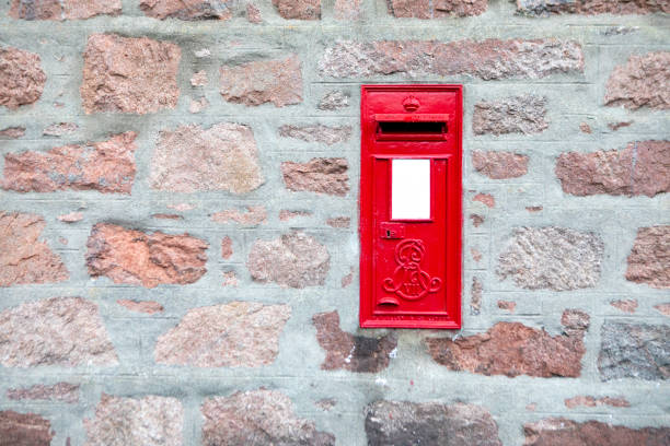 istock Postbox on the wall of a Scottish house 2180573486