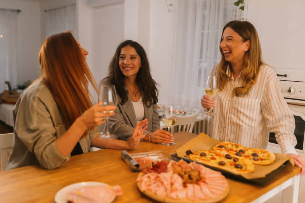 istock Friends Gathering In Kitchen For Party 2180578925