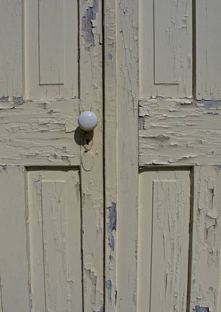 Old weathered door with peeling paint in Iowa.