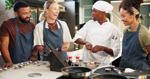 istock Cooking, class and chef in kitchen with ingredient preparation, teaching gourmet meal recipe or learning skills. Culinary course, people or mentor with lesson on food education and cuisine knowledge 2180584734