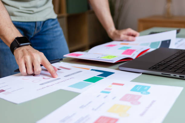 istock Marketing specialist pointing at website wireframe developing visual identity for brand 2180584960