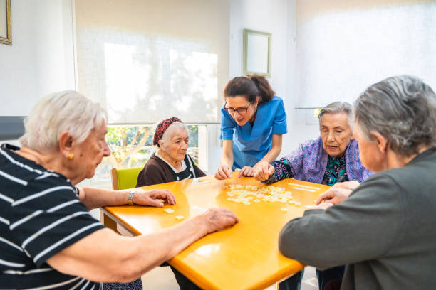 Nurse and senior people playing board skill games