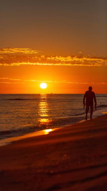 istock Sunrise with silhouette of man 2180587652