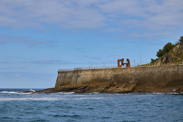 istock Waves crash against the rocks 2180588446