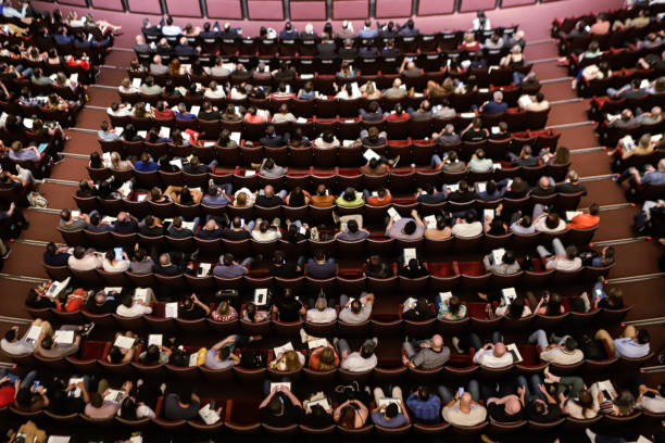 istock Theater audience with a view from above with almost all the seats occupied 2180593627