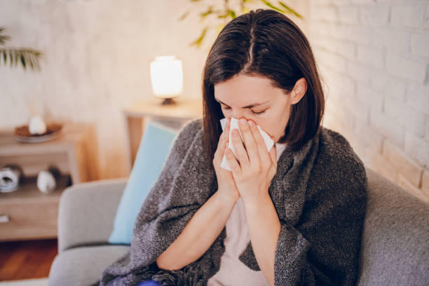 istock Sick woman sitting at home 2180593788