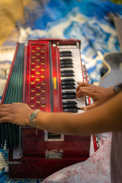 istock Expert woman playing the harmonium 2180593829
