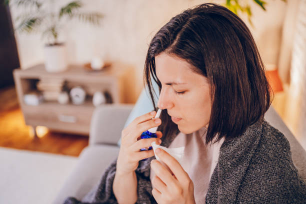 istock Sick woman sitting at home 2180593874