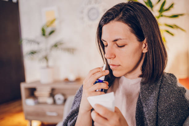 istock Sick woman sitting at home 2180594611