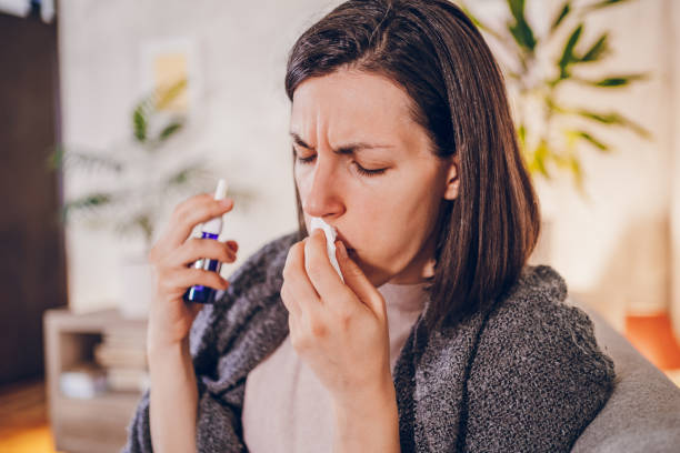 istock Sick woman sitting at home 2180594655