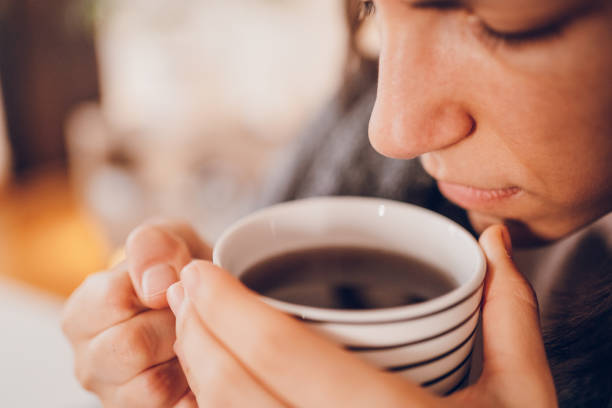 istock Woman with flu drinking hot tea 2180595270