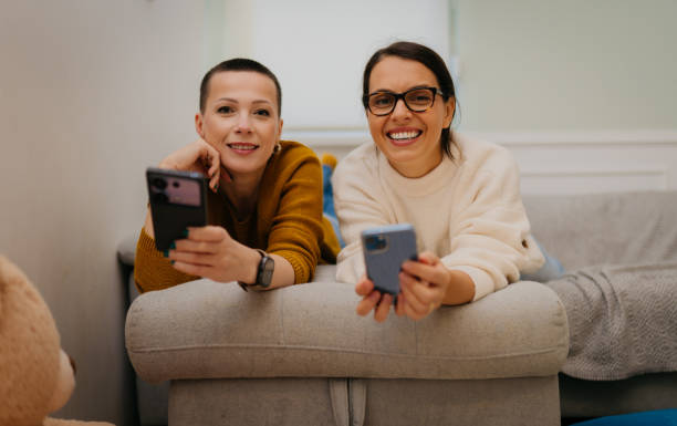 istock Let's check our phones 2180600344
