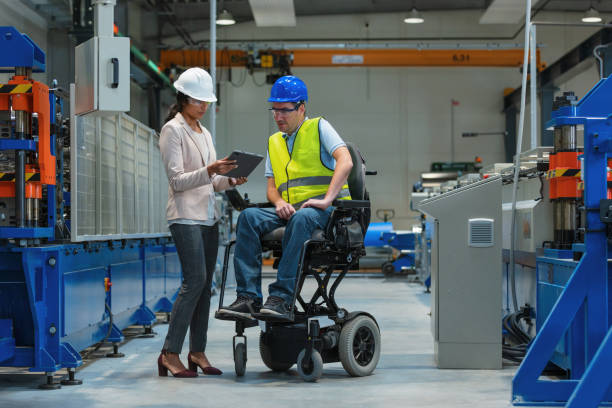 istock Female manager training a new employee with a disability for a job 2180607655
