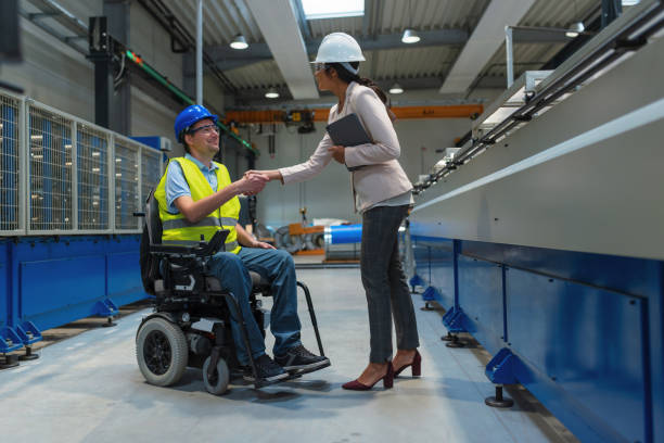 istock Indian woman, a manager, shaking hands to employee with a disability 2180608073