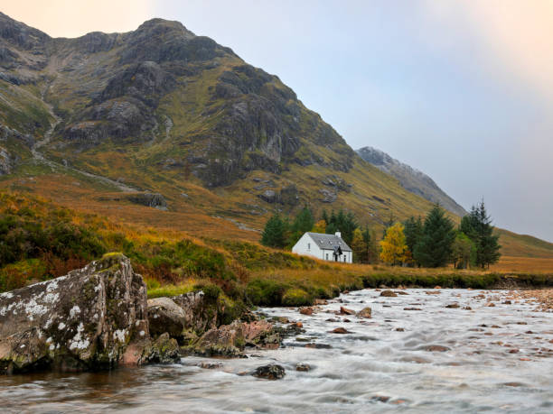 Glencoe, Scotland - Oct 13, 2024: The Lagangarbh White Cottage in Glencoe, Scotland.  Originally a crofter's home, it is now owned by the National Trust for Scotland, and has been occupied and maintained for climbers by the Scottish Mountaineering Club  since 1946.