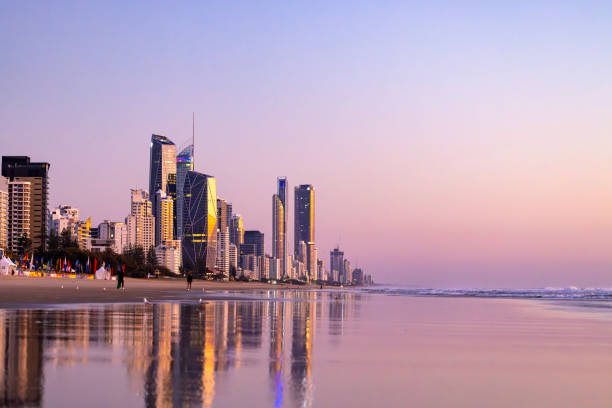 istock Sunrise over ocean with coastal city, background with copy space 2180615275