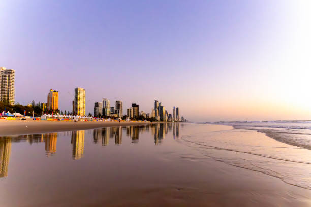 istock Sunrise over ocean with coastal city, background with copy space 2180615728