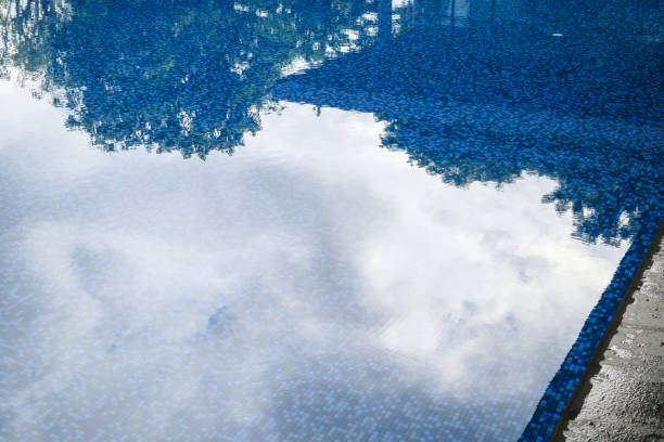 istock Swimming pool water surface and ripple wave with blue mosaic tiles 2180616089