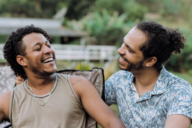 istock Smiling gay couple enjoying together outdoors 2180622607