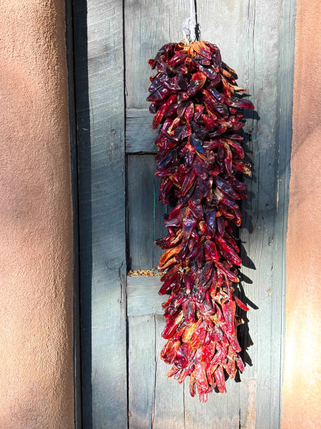 istock Santa Fe, NM: Red Chili Pepper Ristra, Rustic Gray Door 2180644257