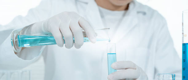 istock Scientist analyze biochemical samples in advanced scientific laboratory. Medical professional use dropper mix microbiological developmental of viral. Biotechnology research in  science lab. cosmetic 2180645222